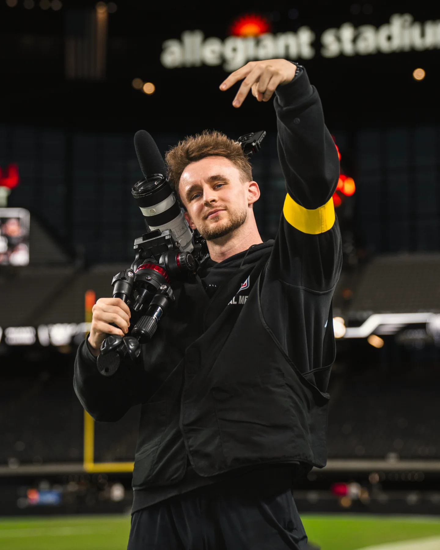 Ricky Witt filming from the sideline at Allegiant Stadium